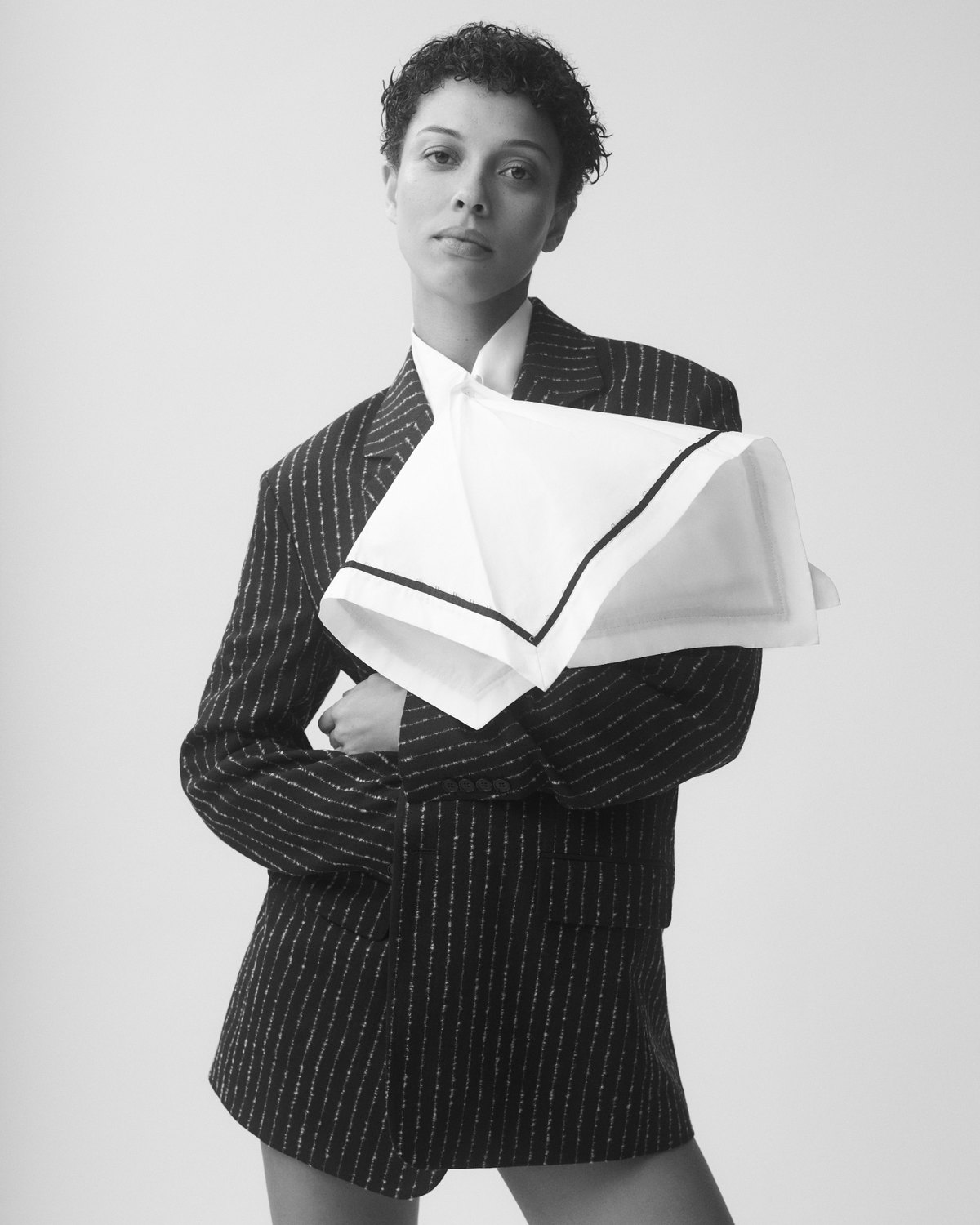 Faith Love Hope editorial: pinstripe blazer with a folded white collar, black and white