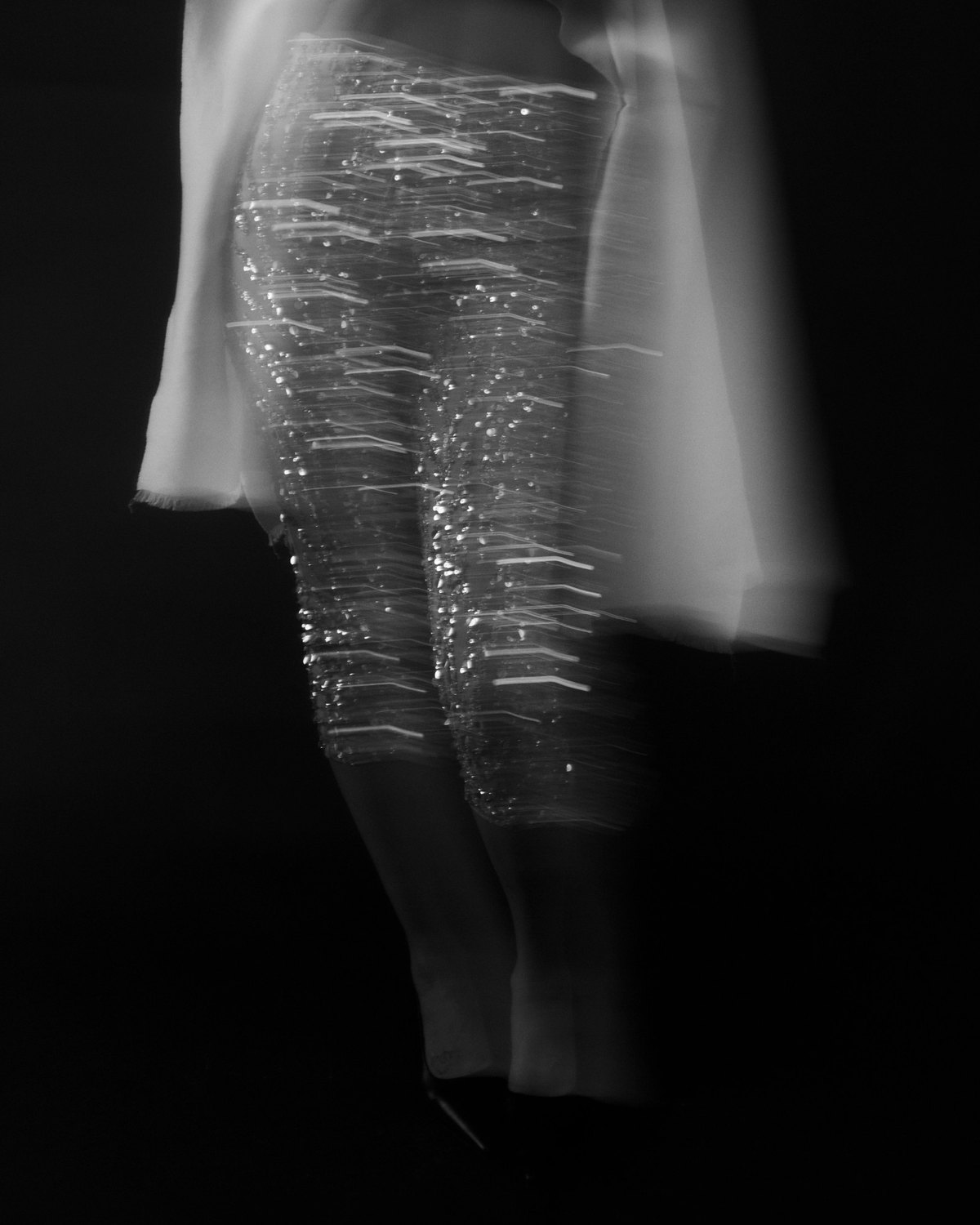 Faith Love Hope editorial: sequinned trousers in motion blur, black and white