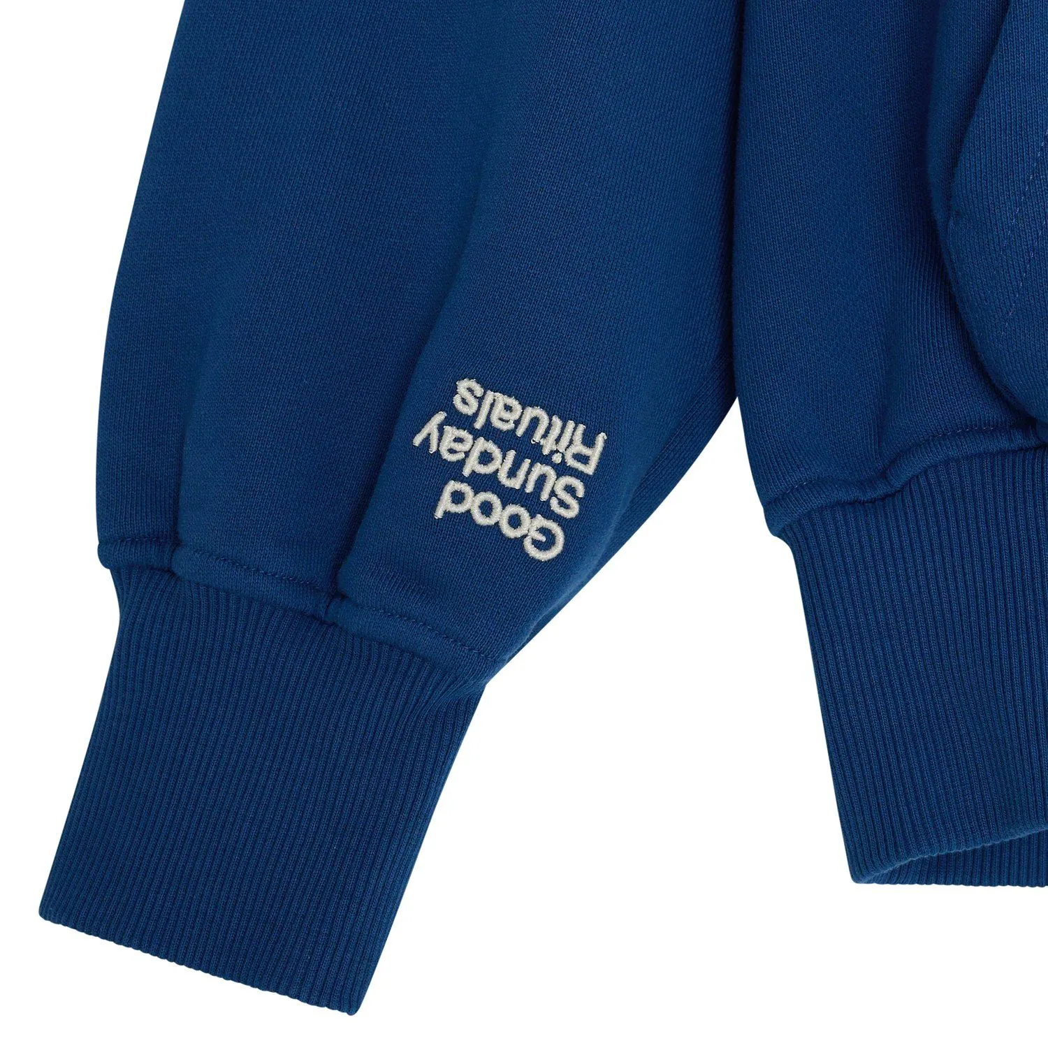 Good Sunday Rituals hoodie cuff embroidery detail flat lay photography