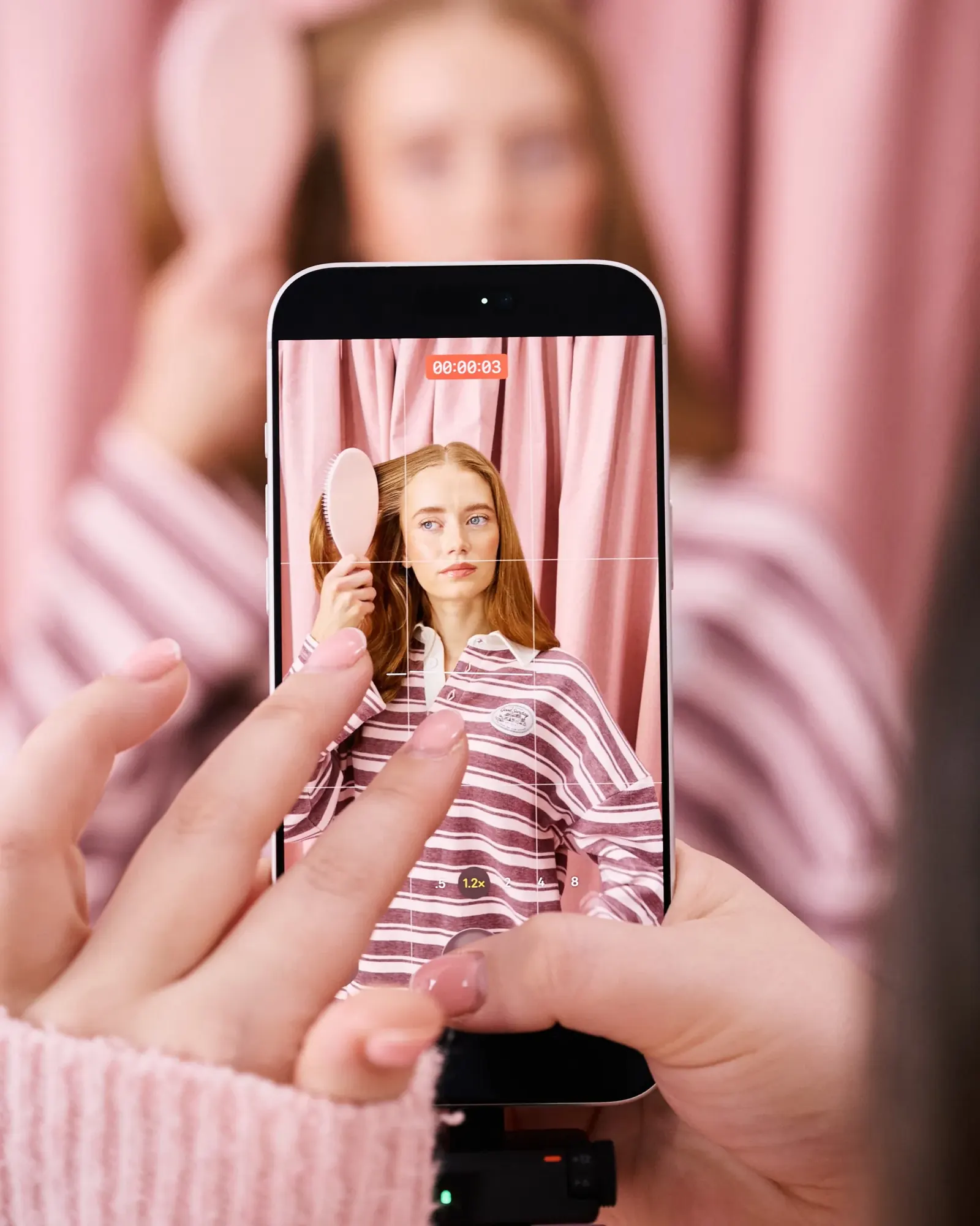 Model photographed against a backdrop for social and campaign use