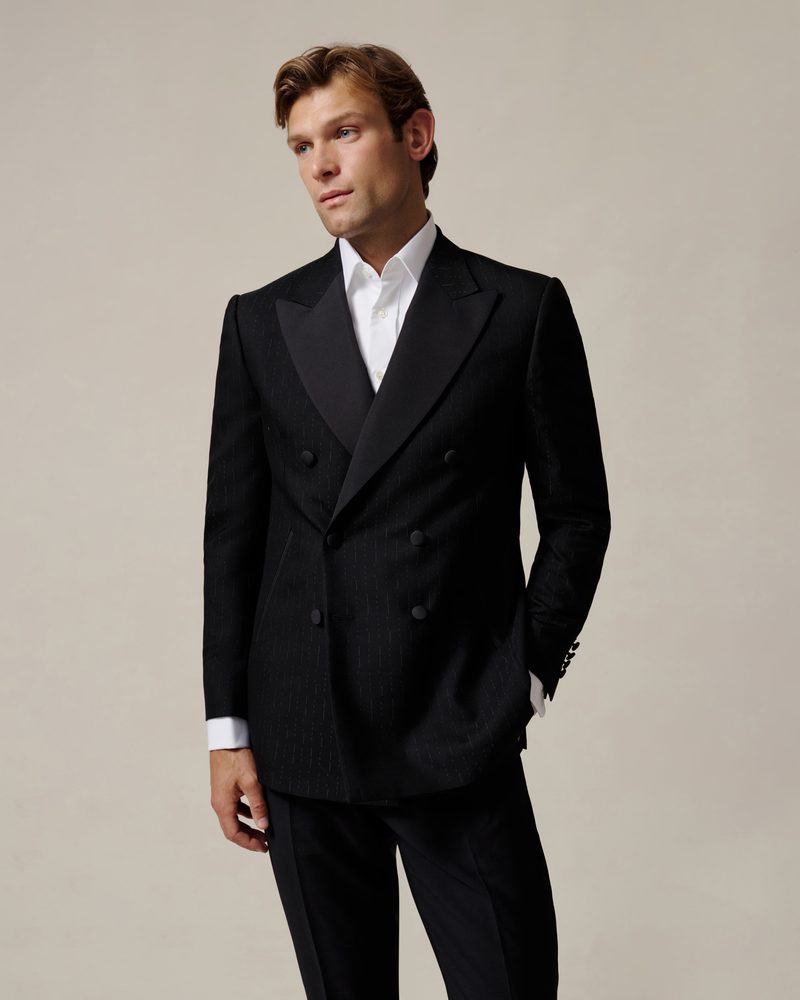 Menswear tailoring ecommerce photography of a black suit and white shirt