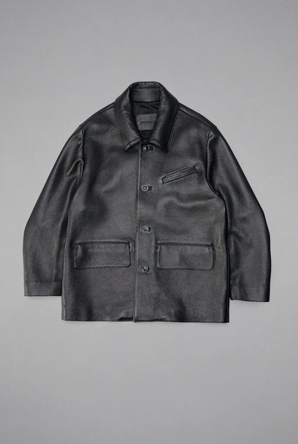 Peace Begins Within black leather jacket flat lay photography
